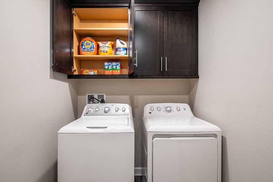 Laundry room in common area with washer and dryer