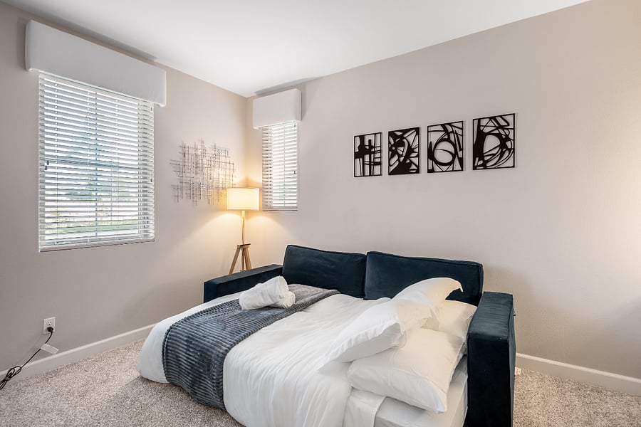 Multi-use room with queen sofa bed and workspace potential