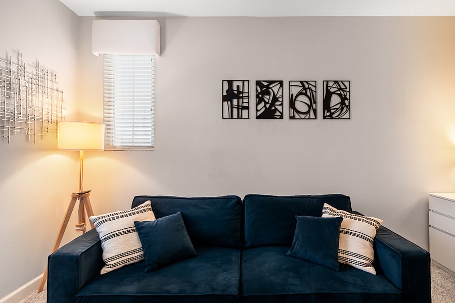 Multi-use room with queen sofa bed and workspace potential
