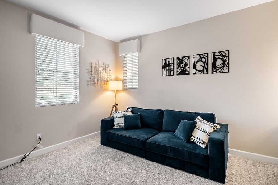 Multi-use room with queen sofa bed and workspace potential
