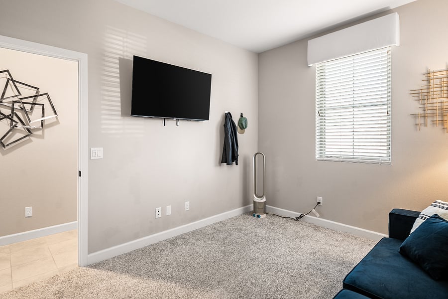 Multi-use room with queen sofa bed and workspace potential