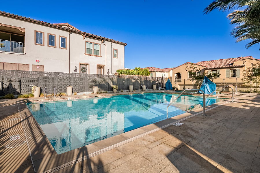 Well-maintained community pool with hot tub for relaxed swimming and downtime