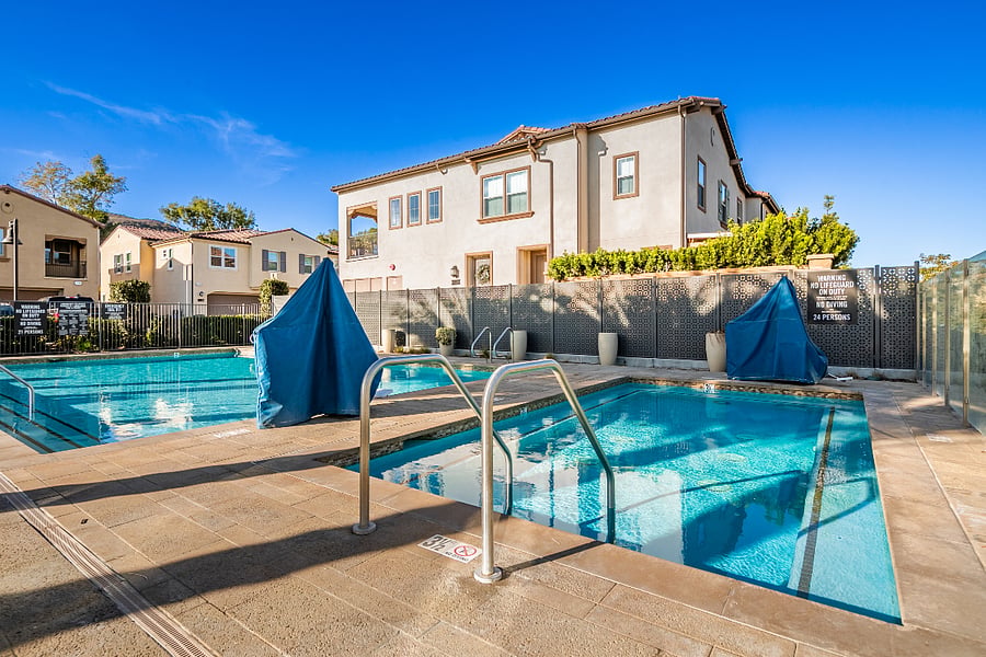 Well-maintained community pool with hot tub for relaxed swimming and downtime