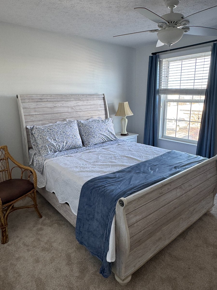 Queen bed with all linens and window blind with black out drapes. Chest of drawer (not shown).
