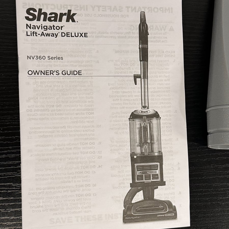Dyson vacuum with attachments provided.