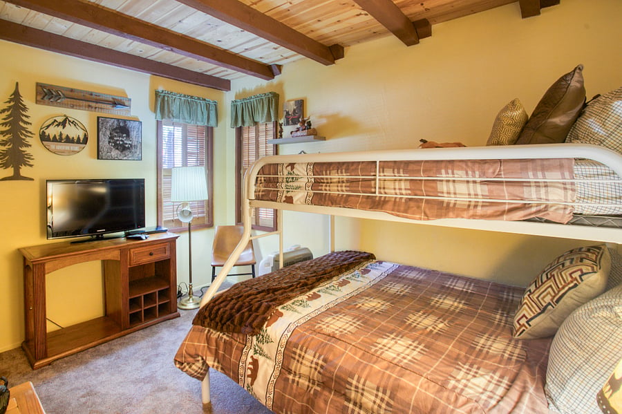 Full size bed on bottom, twin on top.