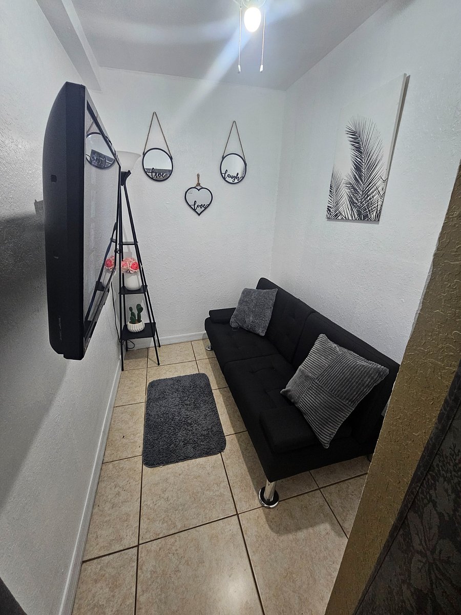 Small spare room 7ft x 5.5 ft = 38.5 sq.ft. Comes with a small 32 in smart TV, and a foldable futon twin bed (39"x75") folds back to a sofa.