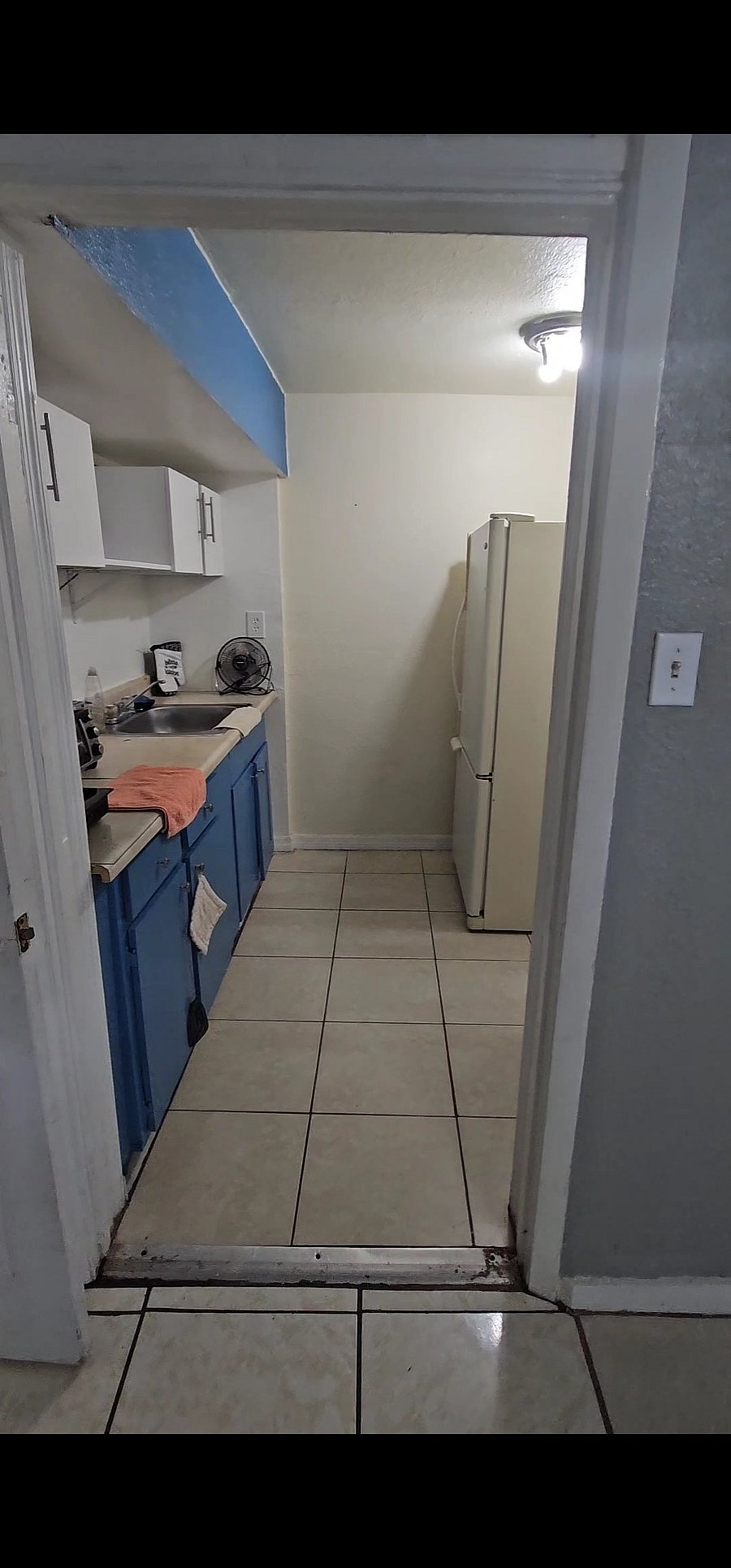 Kitchenette with essential appliances, medium size-fridge, microwave, small sink, air fryer, toaster, utensils and extra storage cabinets. 8ft x 7ft = 56sq.ft.