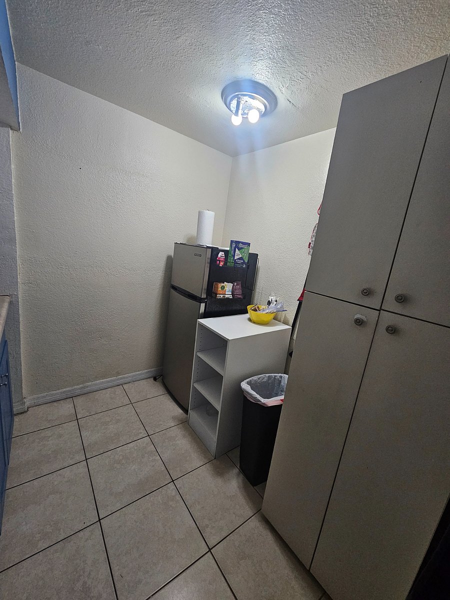 Medium size refrigerator 4ft height by 2ft wide. Large cabinet for extra space.