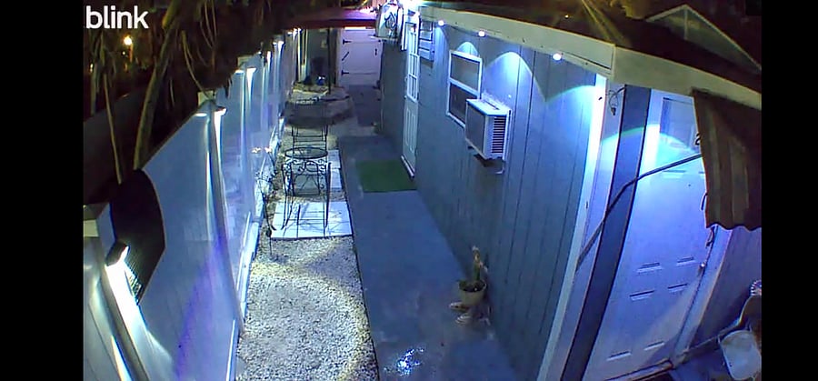 Night view of exterior of walkway to your unit, with well lit esteeior. 