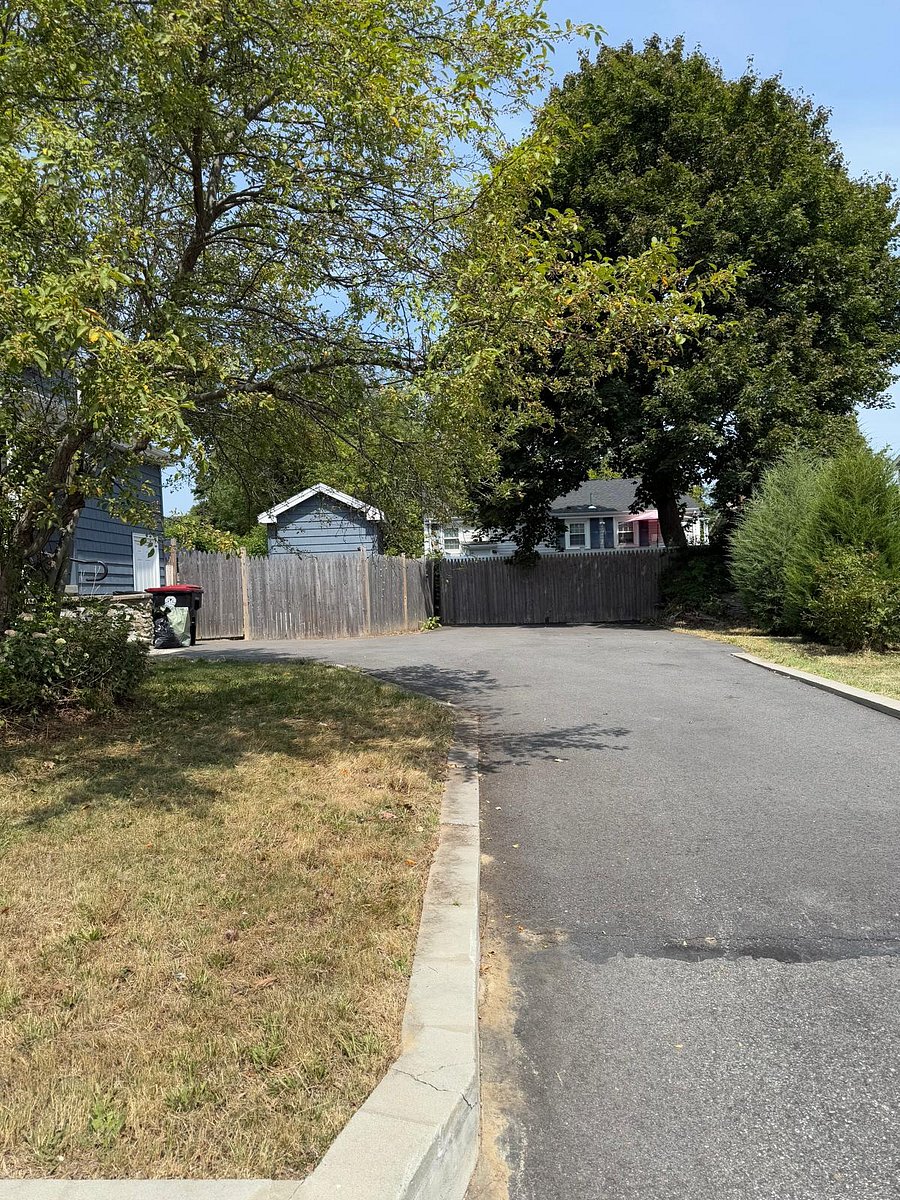 3-4 car driveway and trash