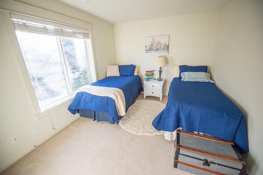 Upstairs second bedroom with two insanely comfortable twin beds and a nice backyard view.