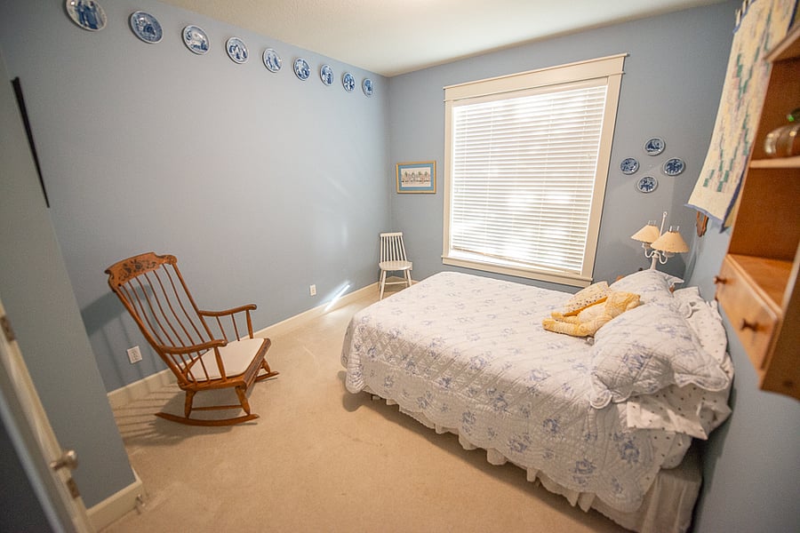 The downstairs guest bedroom is adjacent to a full bathroom.