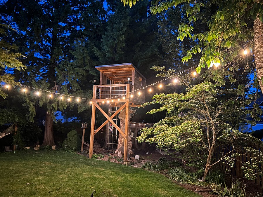 Party lights add to the evening ambiance every day. Note, the tree fort is now merely decoration and is not functional.