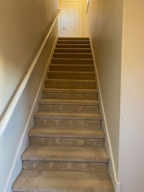 Interior stairs to condo