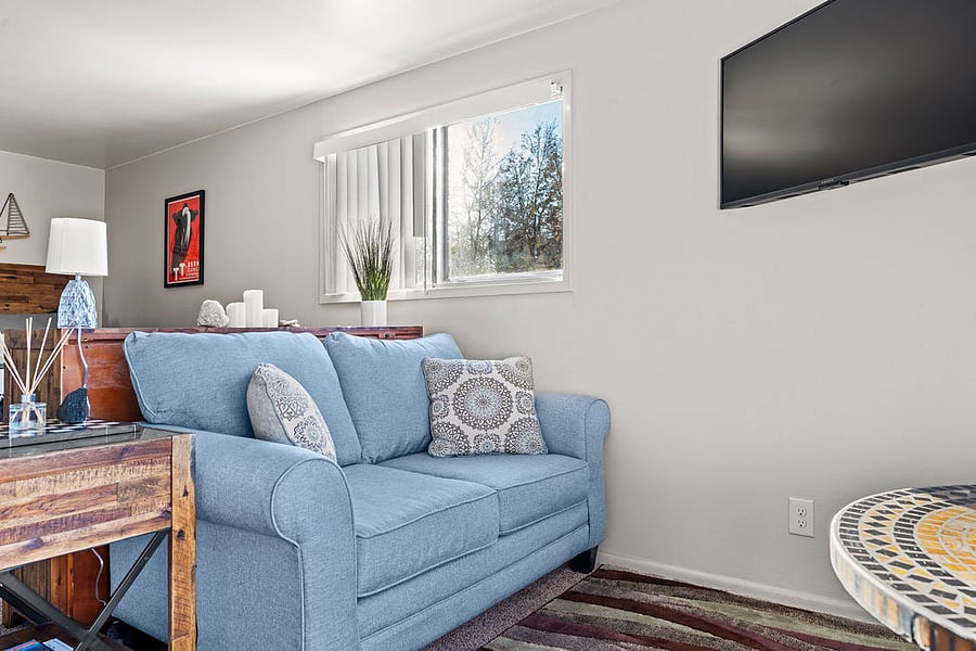 Spacious living room, perfect for rolling out your yoga mat and stretching out!