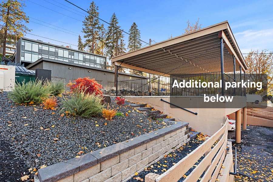 Well-maintained walkway offers convenient access to upper-level parking, with additional parking available on the lower level for added flexibility.
