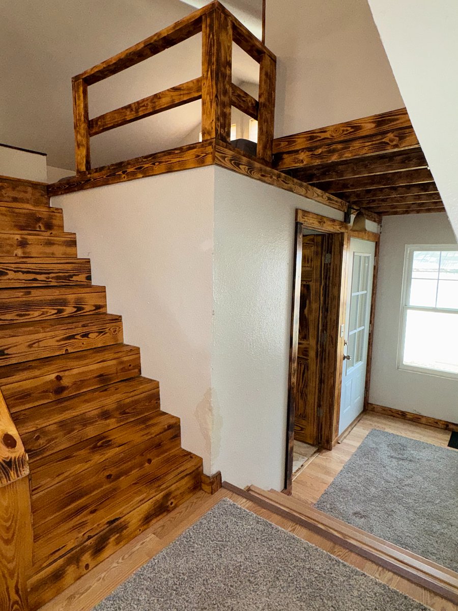 Stairs to Bedroom 2 loft with 2 XL Twin beds, and entry area.