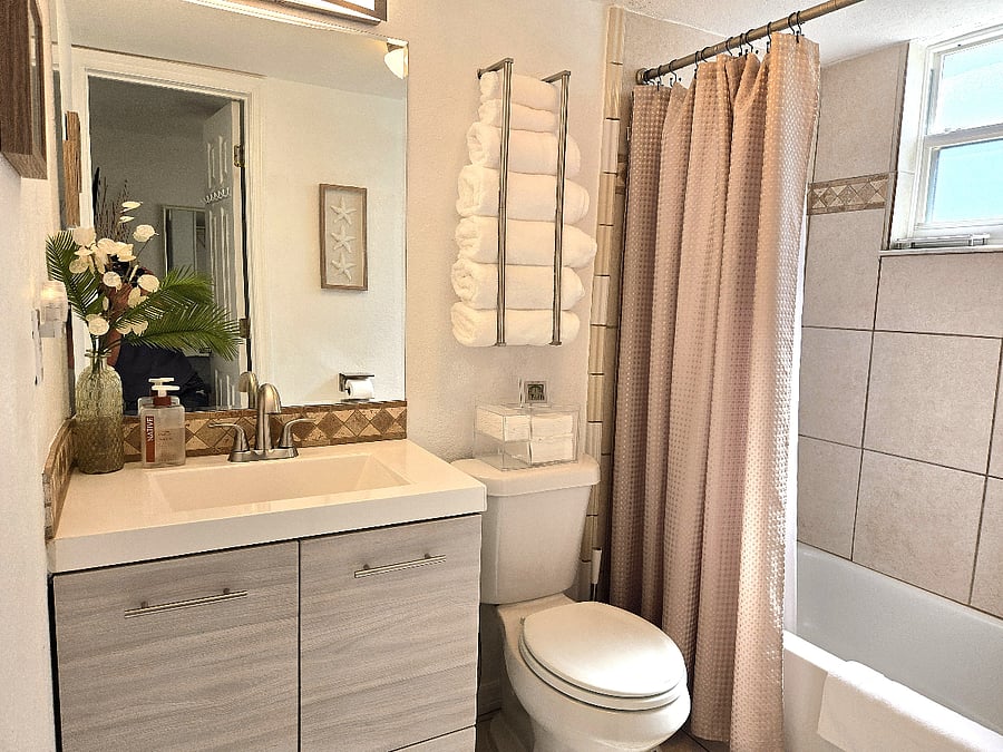 Well-appointed bathroom with ample towels and storage for longer stays