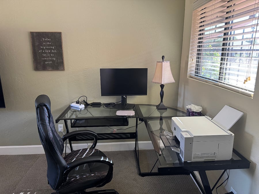 Work from home space with large monitor and color printer.