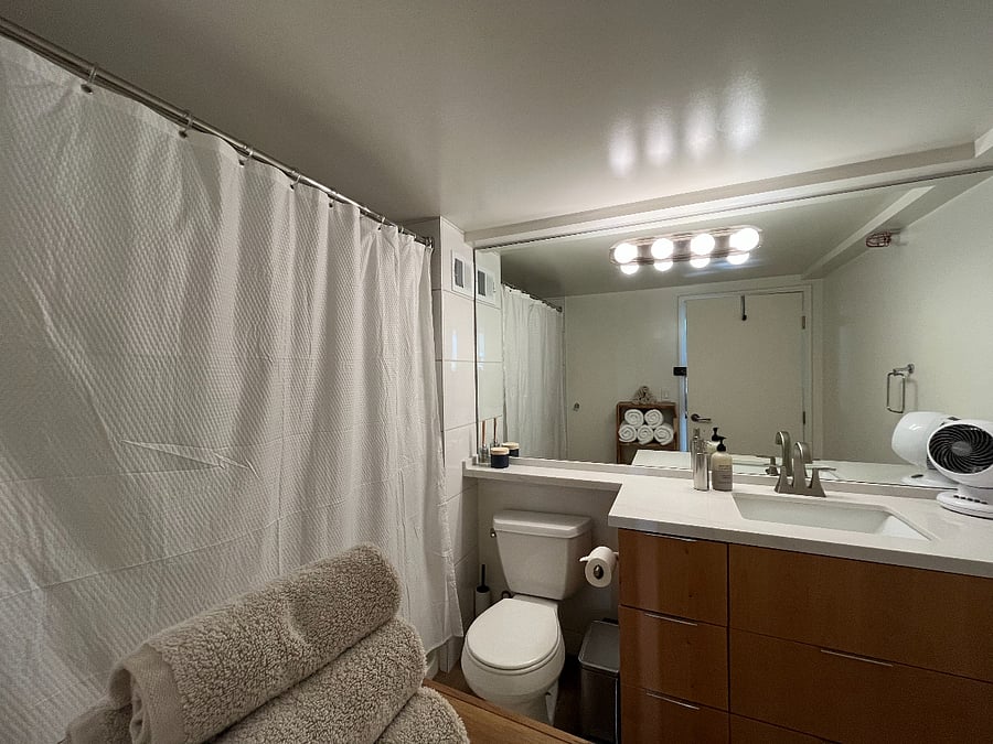 Bathroom, with towels, body and hand soap.