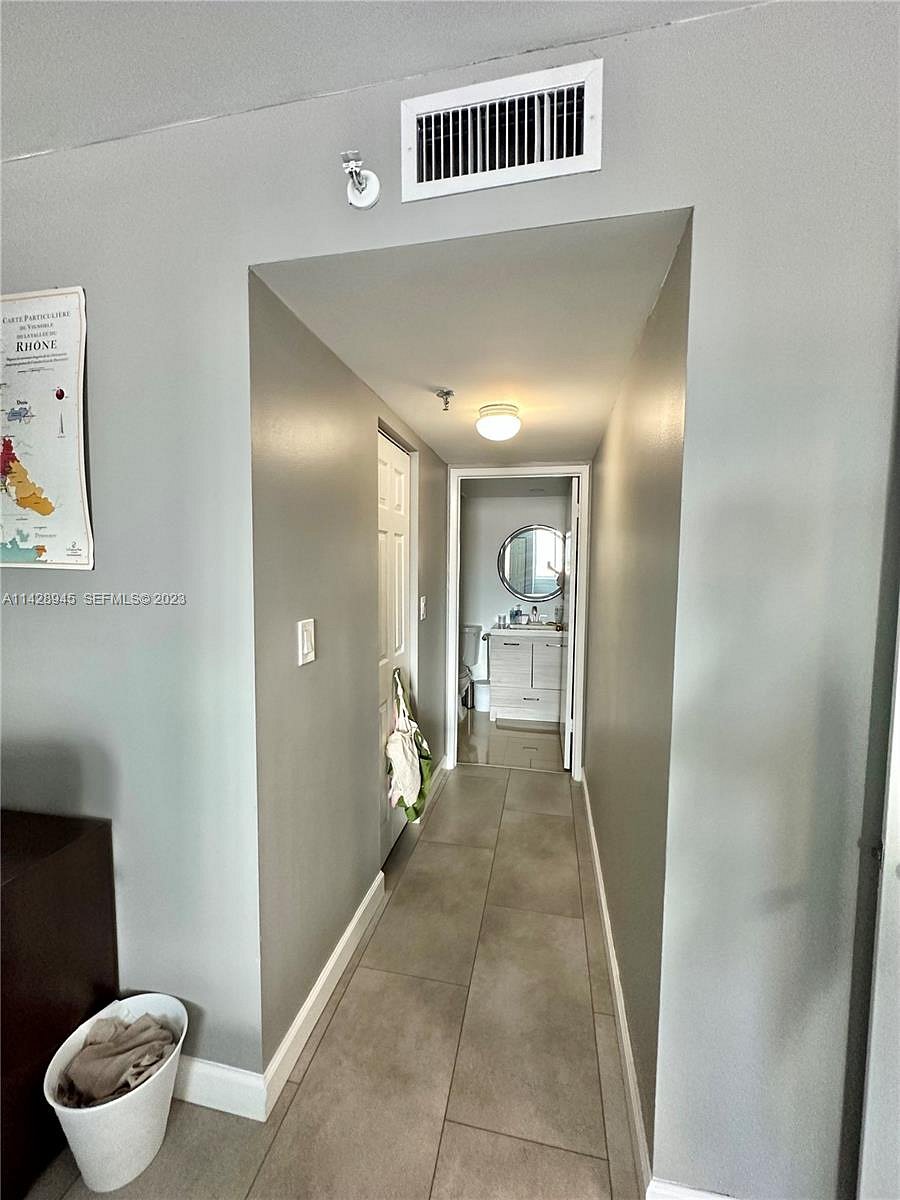 Master bedroom hallway to private bathroom