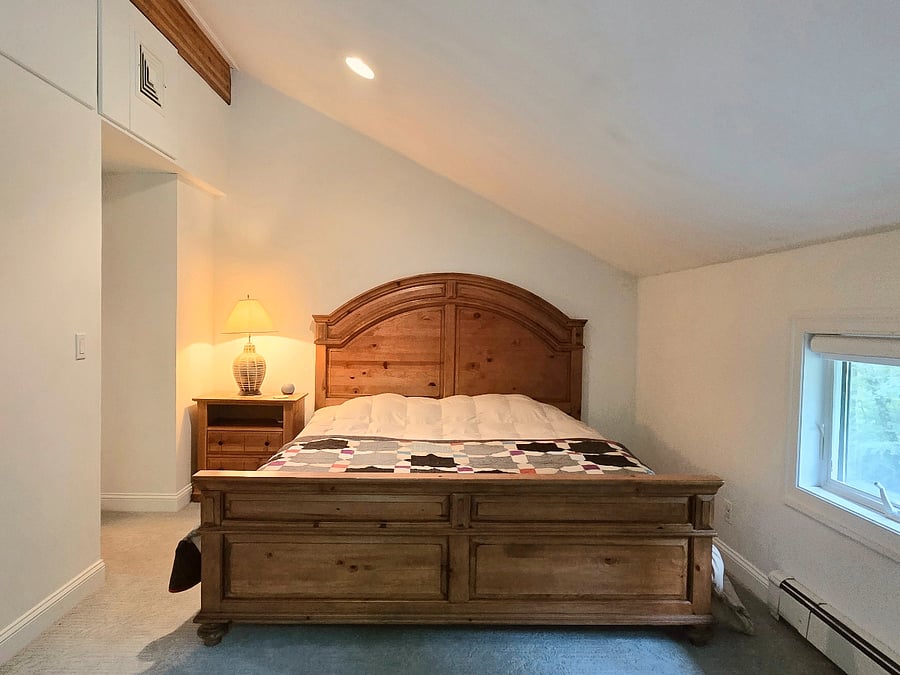 Second floor King bedroom with adjustable bed frame and cozy wool quilt