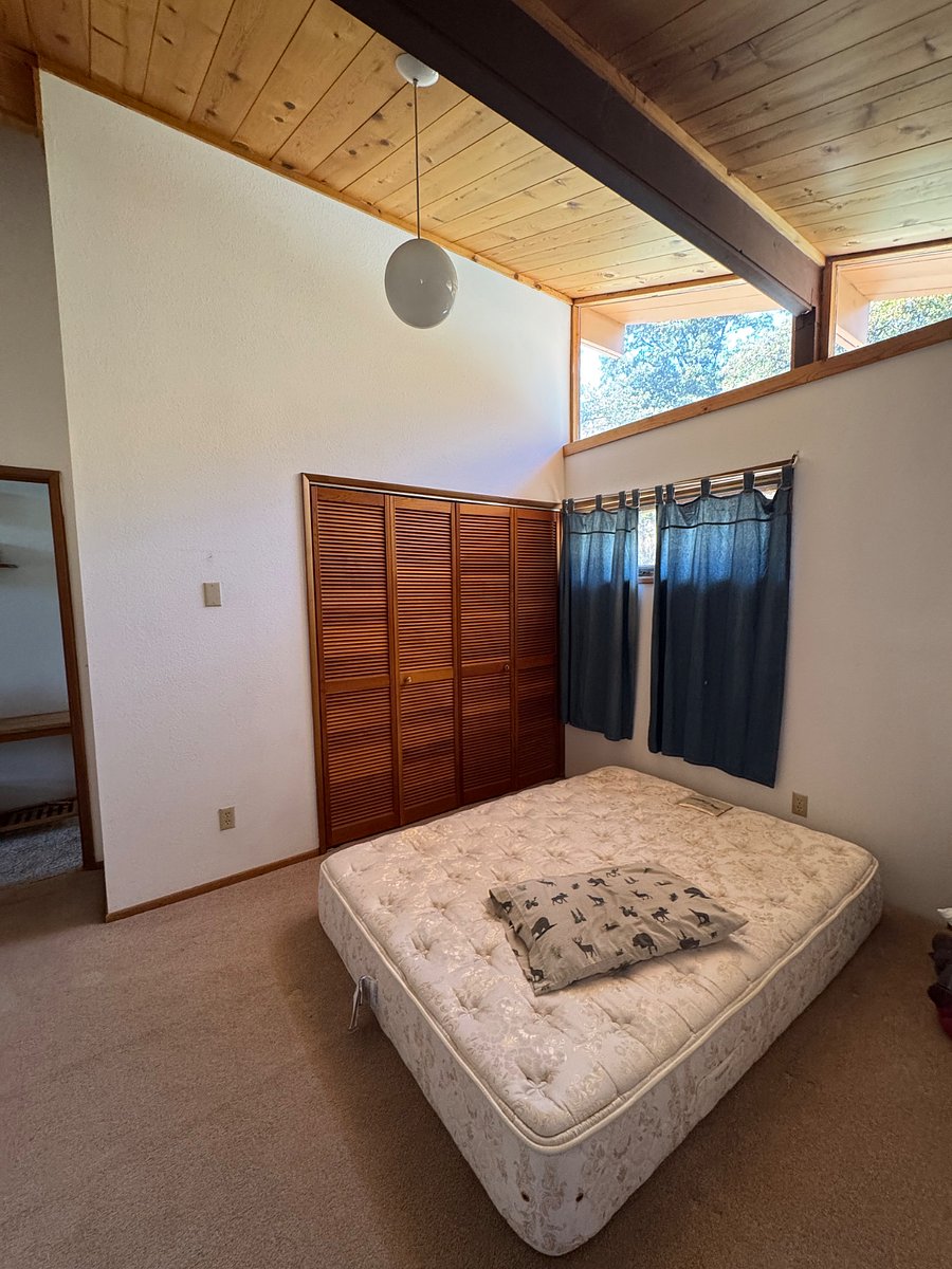 Upstairs bedroom 2 with queen bed and large closet