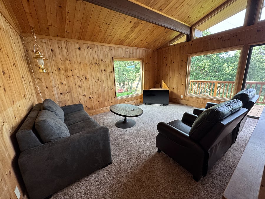 Living room with couch (pull out queen sleeper), 2 recliners and 55 inch TV