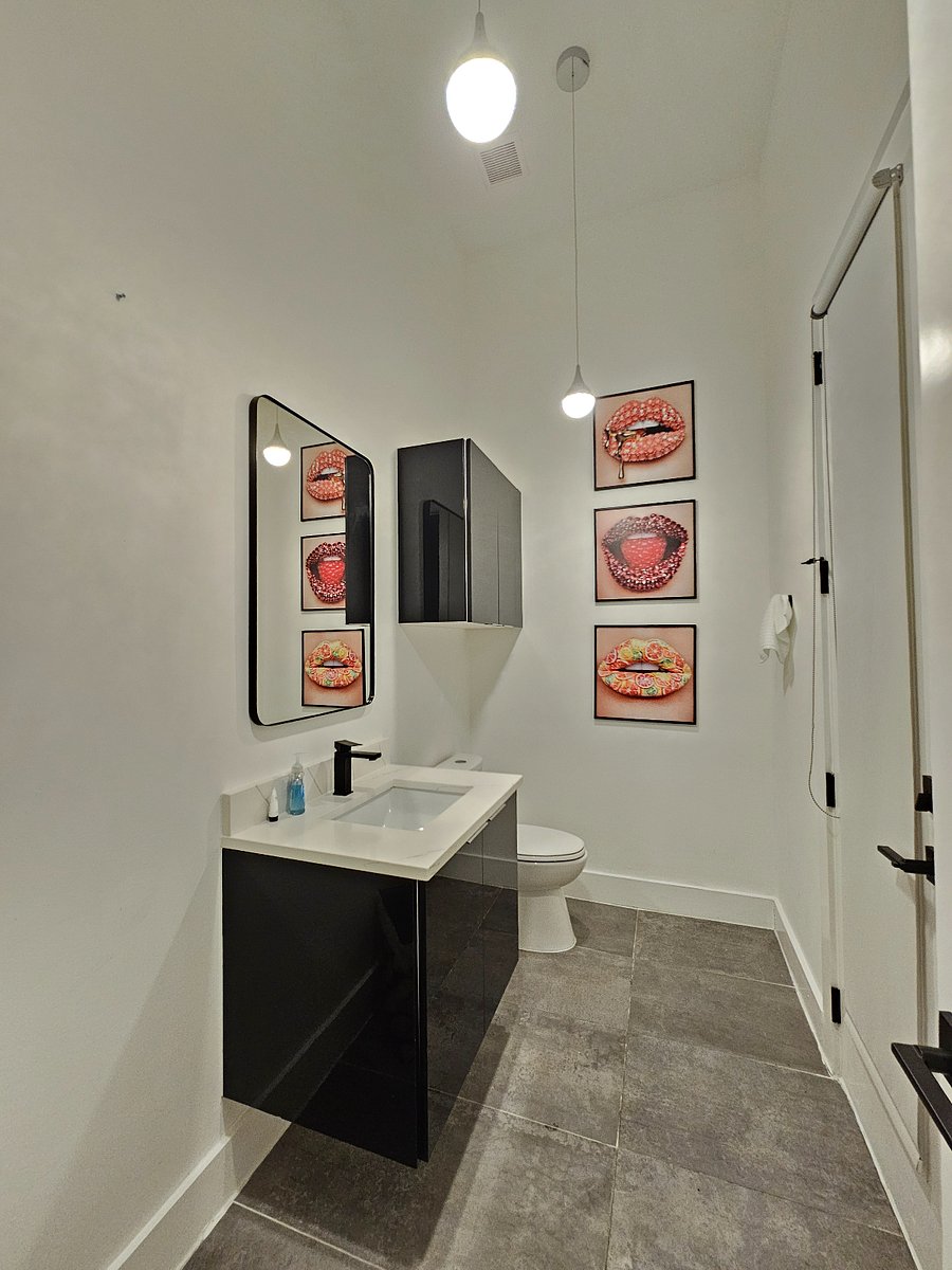 1st Floor Half Bath with access to Outdoor Patio and interior front foyer