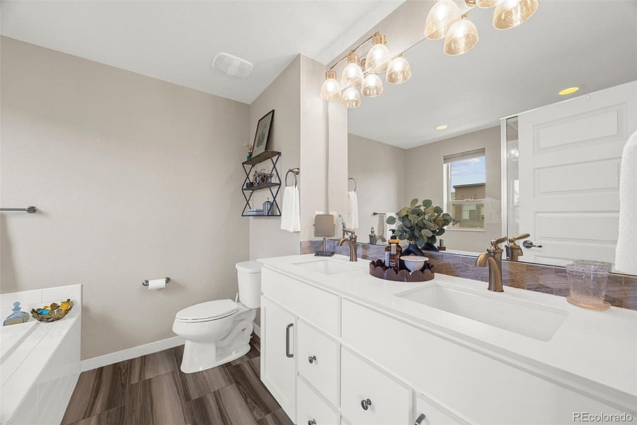 Ensuite bathroom with King bedroom includes walk-in shower, bathtub and double sinks