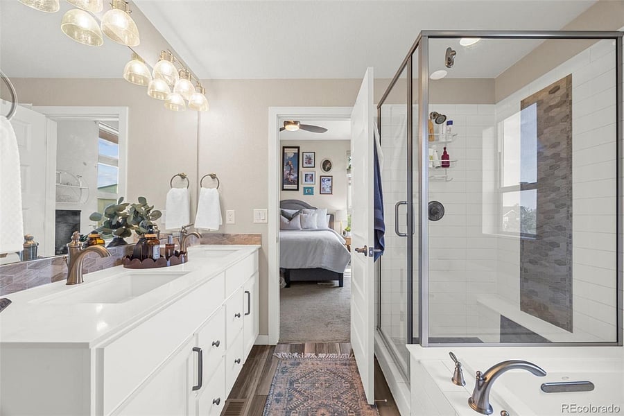 Ensuite bathroom with tub and walk-in shower plus double sinks