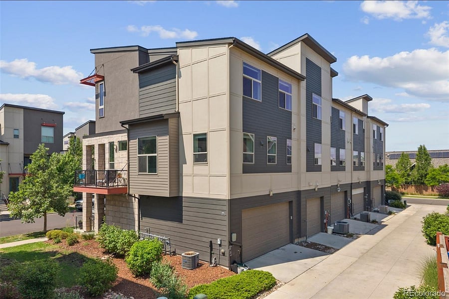 Corner lot with 2-car attached garage and green area