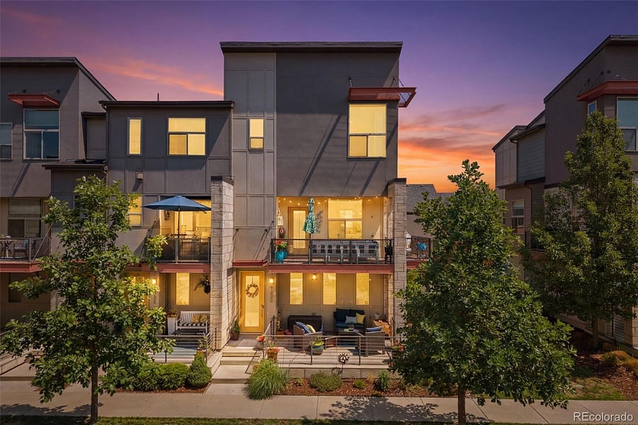 Night time exterior front view with street parking