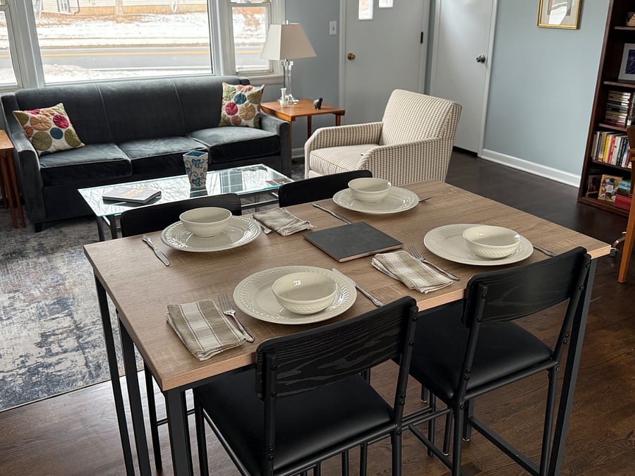 Dining space between kitchen and living room enough for four diners.