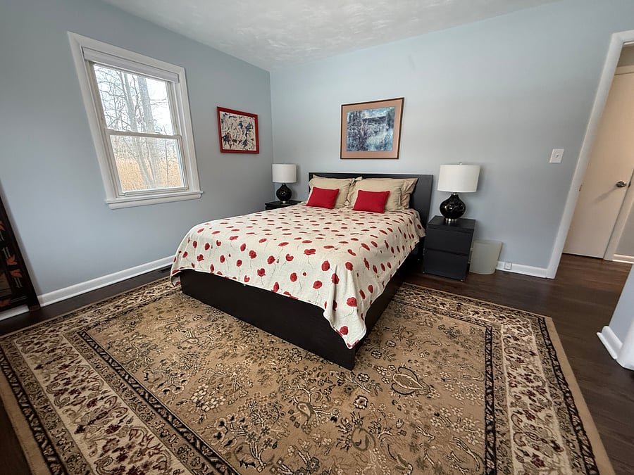 Primary bedroom with queen size bed and Double closet