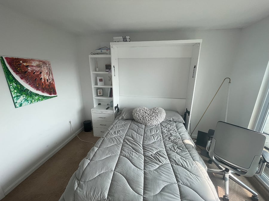Smaller bedroom with Murphy bed pulled down
