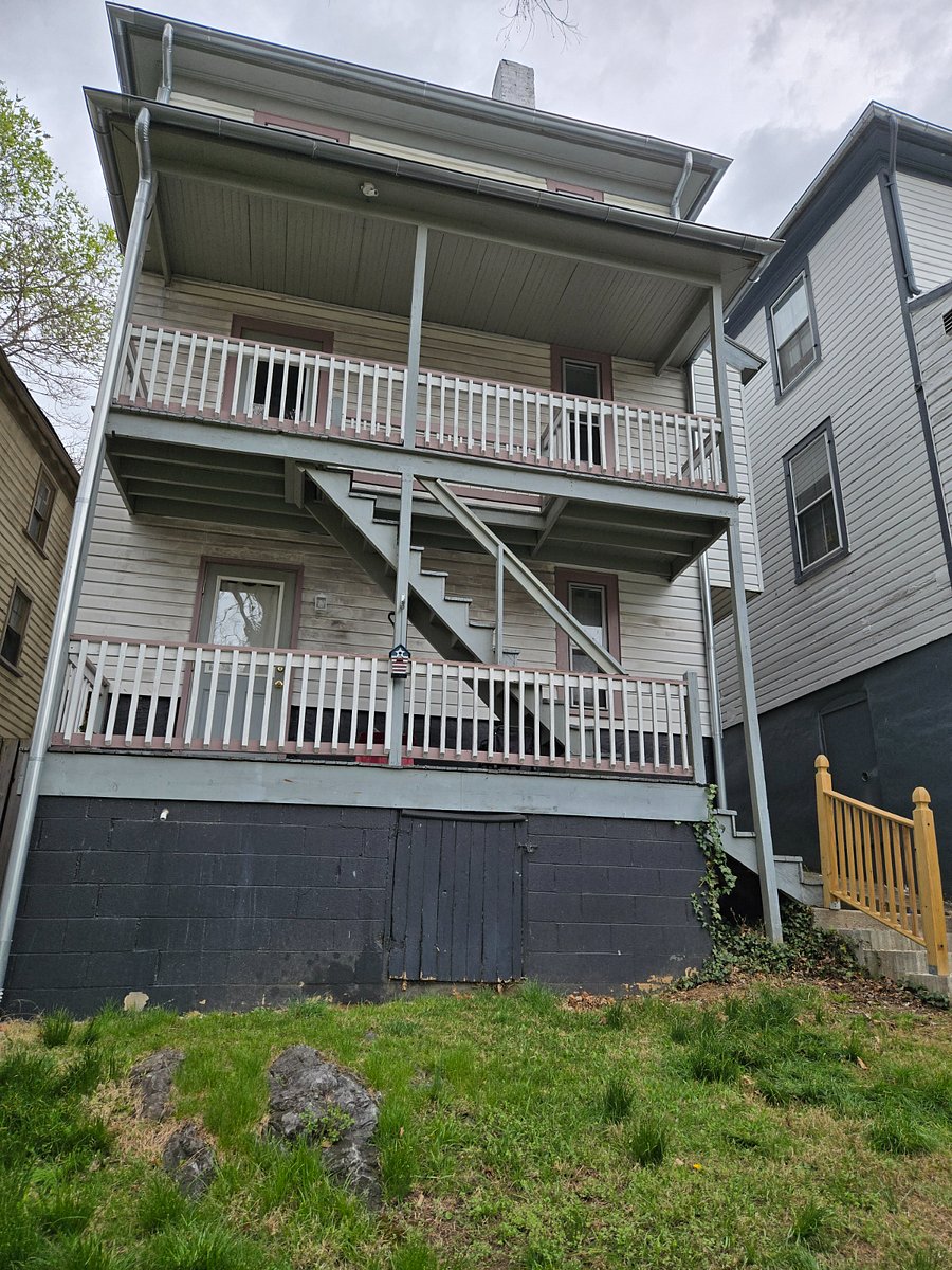 Back of the house showing the studio apartment. stairs go up to the 3 bedroom you would rent