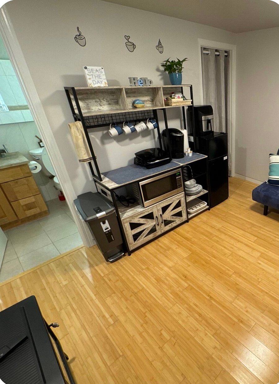 Livingroom of 1bd/1ba unit with stocked kitchenette.