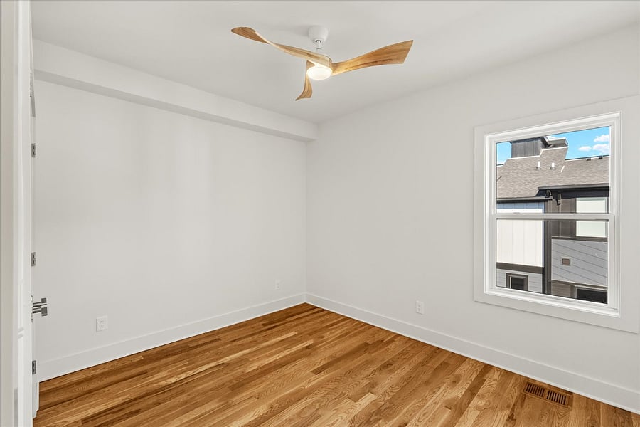 Bedroom available with Queen bed, nightstand, and desk with chair.