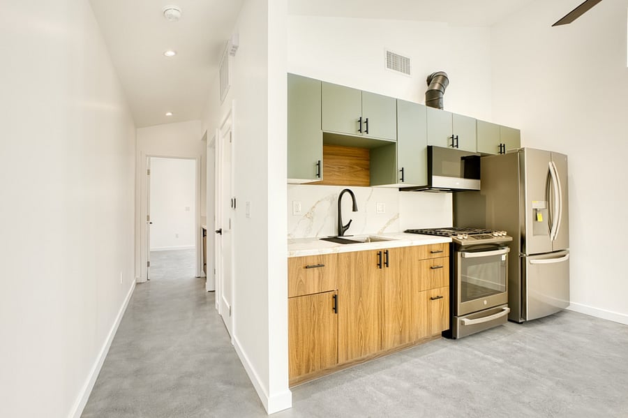 Kitchenette with full size oven, microwave, and refrigerator. 