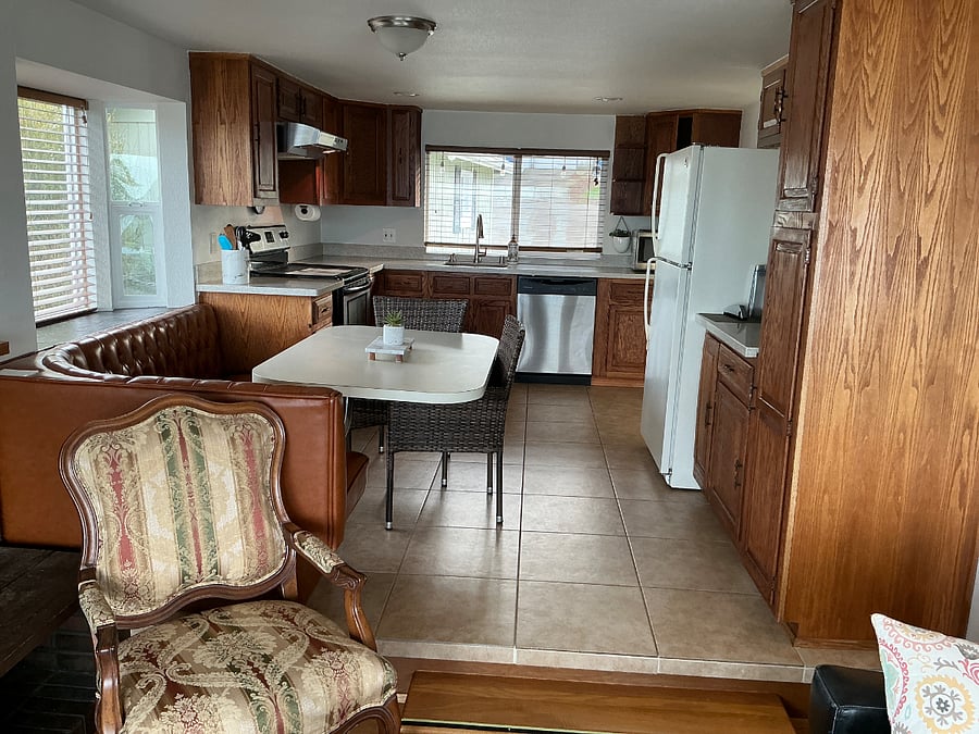 Water view full kitchen with sit down breakfast nook.