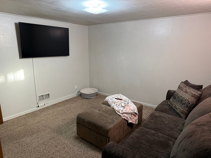Queen size couch bed found in the TV room. Never before used!