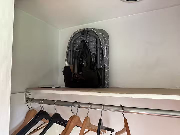 Ironing board and iron available in first floor bedroom closet.