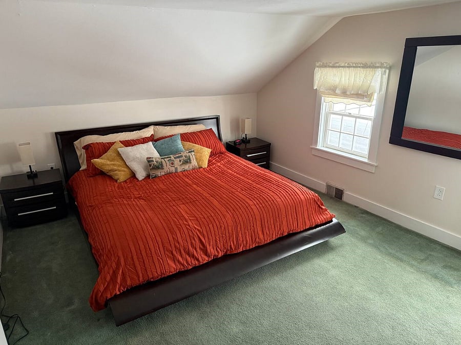 King size bed in second floor master bedroom.