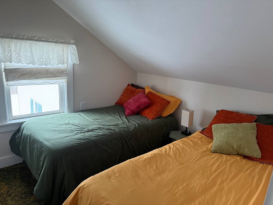 Two twin beds in second floor bedroom.