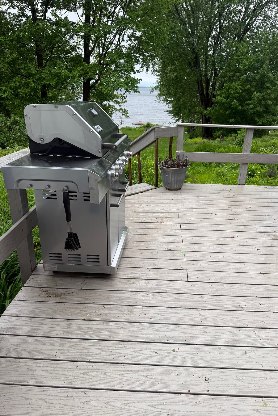 BBQ grill with spare propane tank available for use.