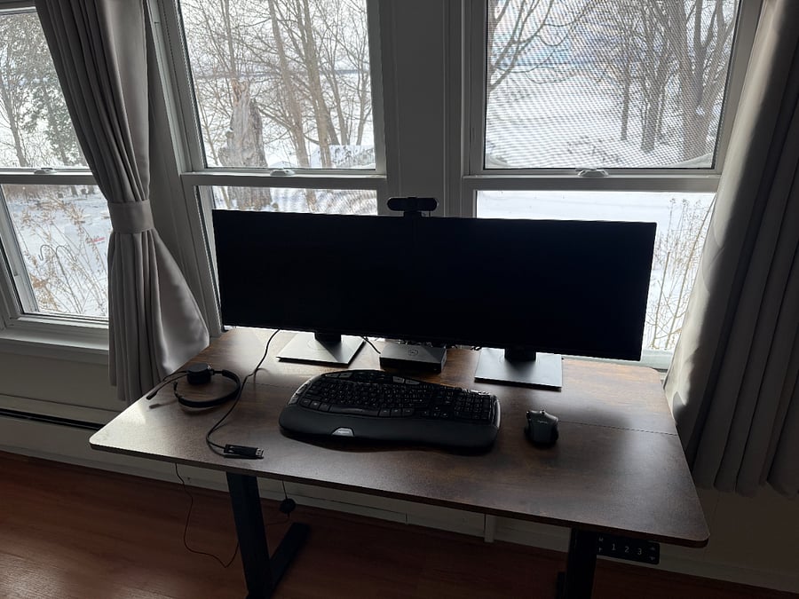 Complete home office setup with docking station (USB C or A), dual monitors, wireless keyboard/mouse, headset, webcam and ergonomic Temperpedic office chair.  All of this on an adjustable height sit/stand desk.