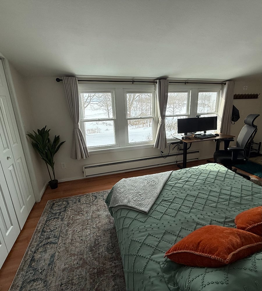 Beautiful lake views from this first floor bedroom with queen size bed and home office.
