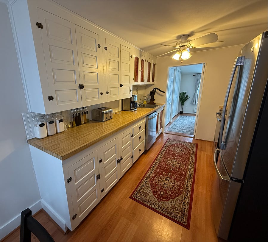 Fully stocked kitchen with grind and brew coffee maker, toaster, air fryer, cooking oils, spices and flours. 